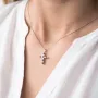 Золотий хрестик з сапфіром і діамантами.