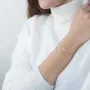 Подвійний золотий браслет. Монетки з фіанітами.