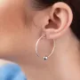 Серьги - кольца Гармония в белом золоте с08364 Оникс
